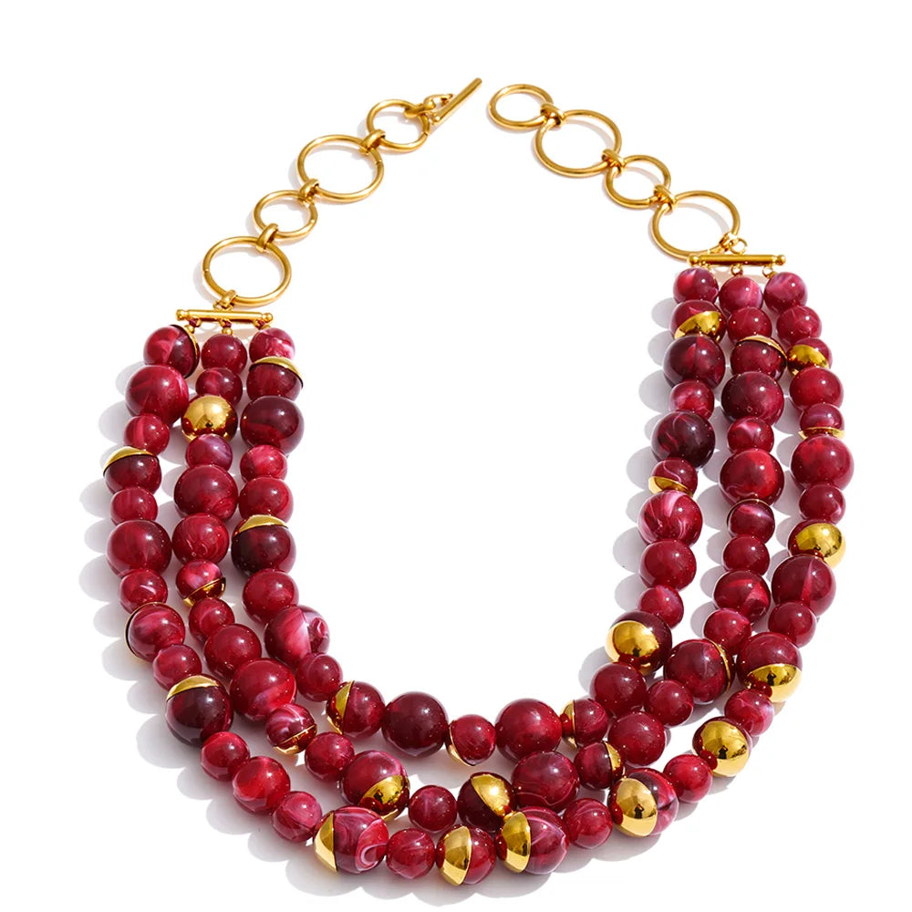 Three-strand layered necklace in crimson marbled beads with gold accents
