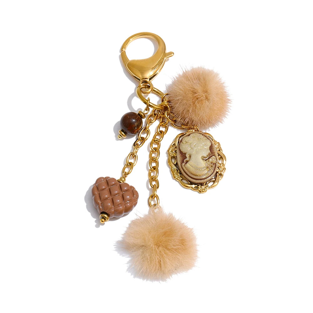 Posy Heart Portrait Keychain in Camel - gold-plated charm keychain with resin cameo, quilted heart and faux fur poms