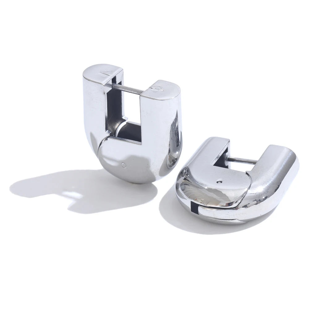 Piper hollow hoop earrings in silver, pair shown on a white background
