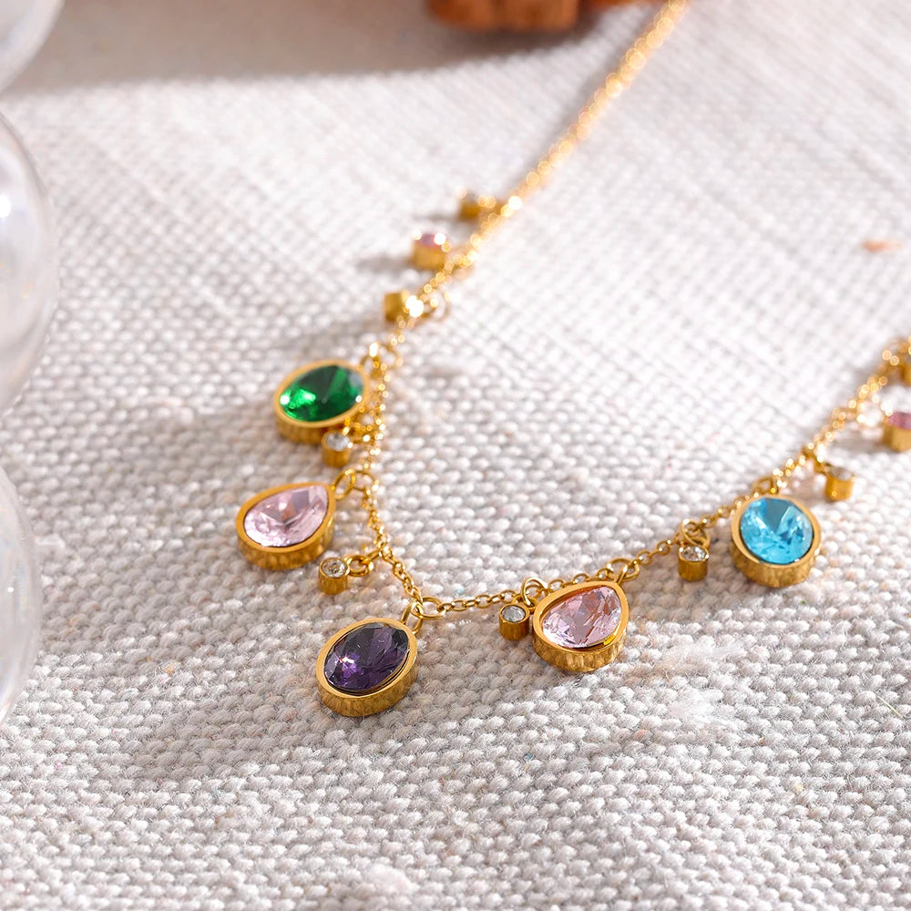 Fern Zirconia Necklace styled on textured linen with glassware