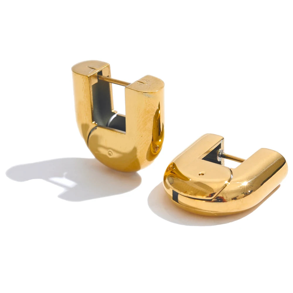 Piper hollow hoop earrings in gold, pair shown on a white background