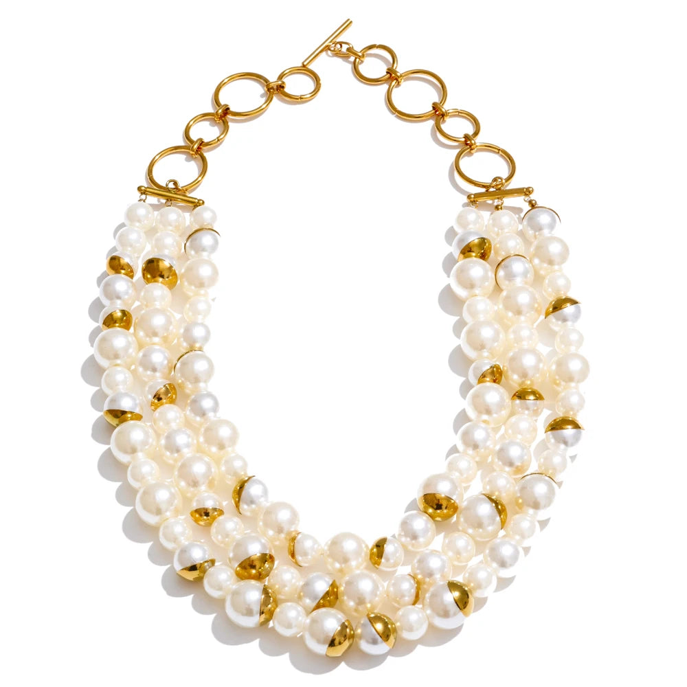 Three-strand layered simulated pearl necklace with gold accents