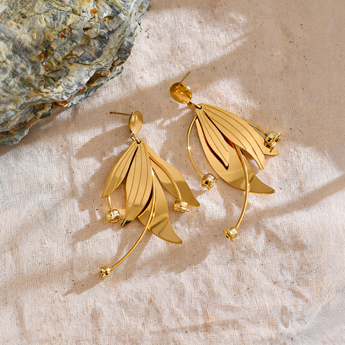 Annie Petal Drop Earrings styled on linen