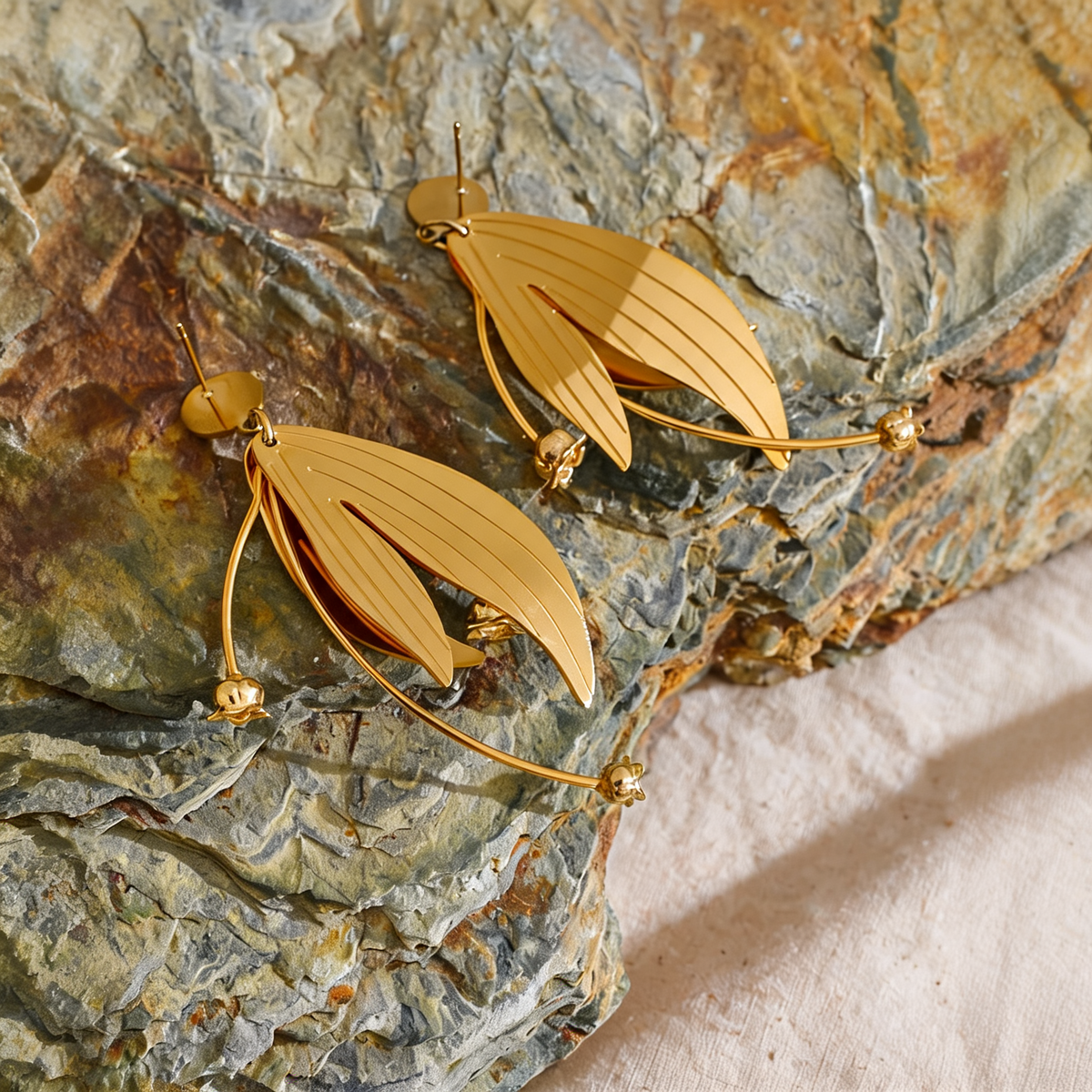 Annie Petal Drop Earrings styled on slate