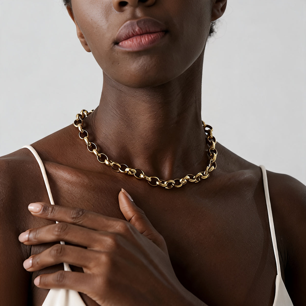 Canyon Textured Collar Necklace in warm gold-plated stainless steel worn on the collarbone
