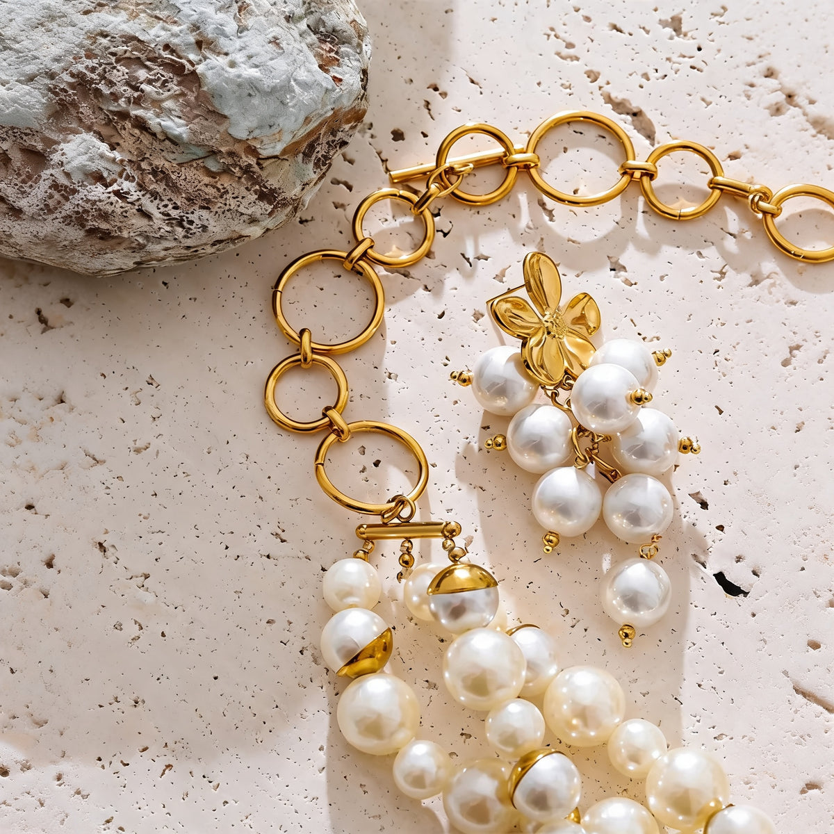 Close-up of the gold O-ring toggle chain and clasp on the layered necklace