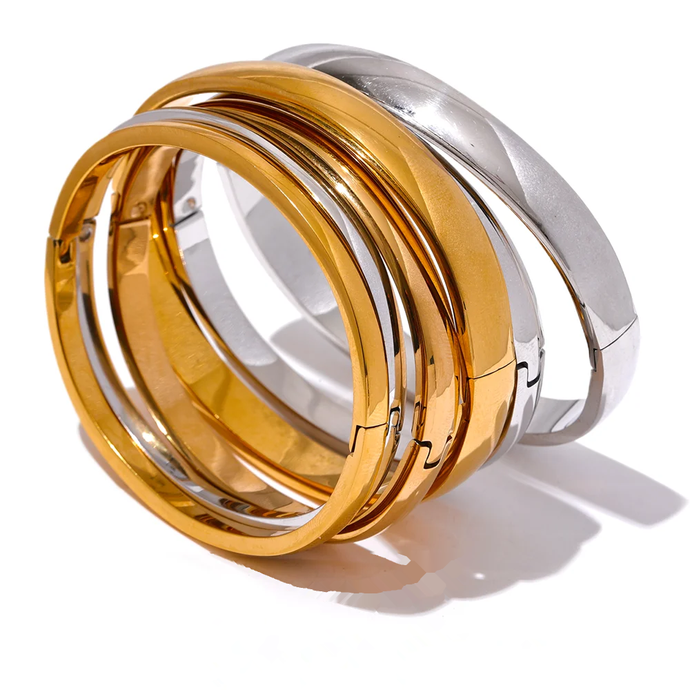 Rowan smooth bangles shown in three widths, gold and silver finishes