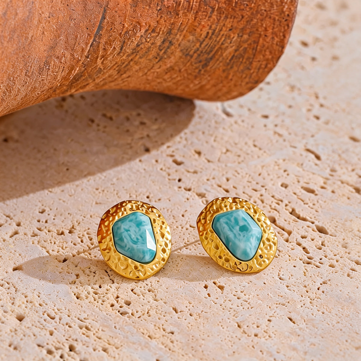 Lottie amazonite stud earrings on a travertine slab with a terracotta vessel