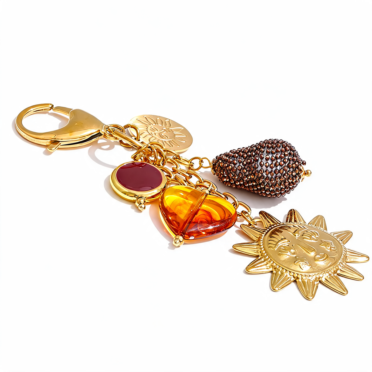 Three-quarter detail of the Marigold sun charm keychain's five charms