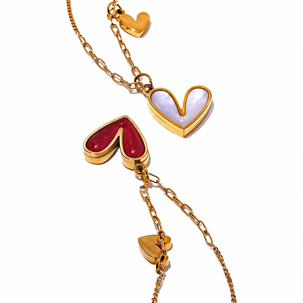 Rosa heart pendants in red enamel and white shell on gold chains