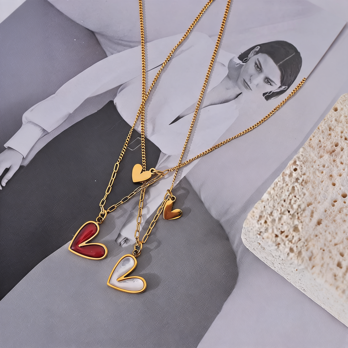 Rosa heart necklaces in red enamel and white shell on grey silk