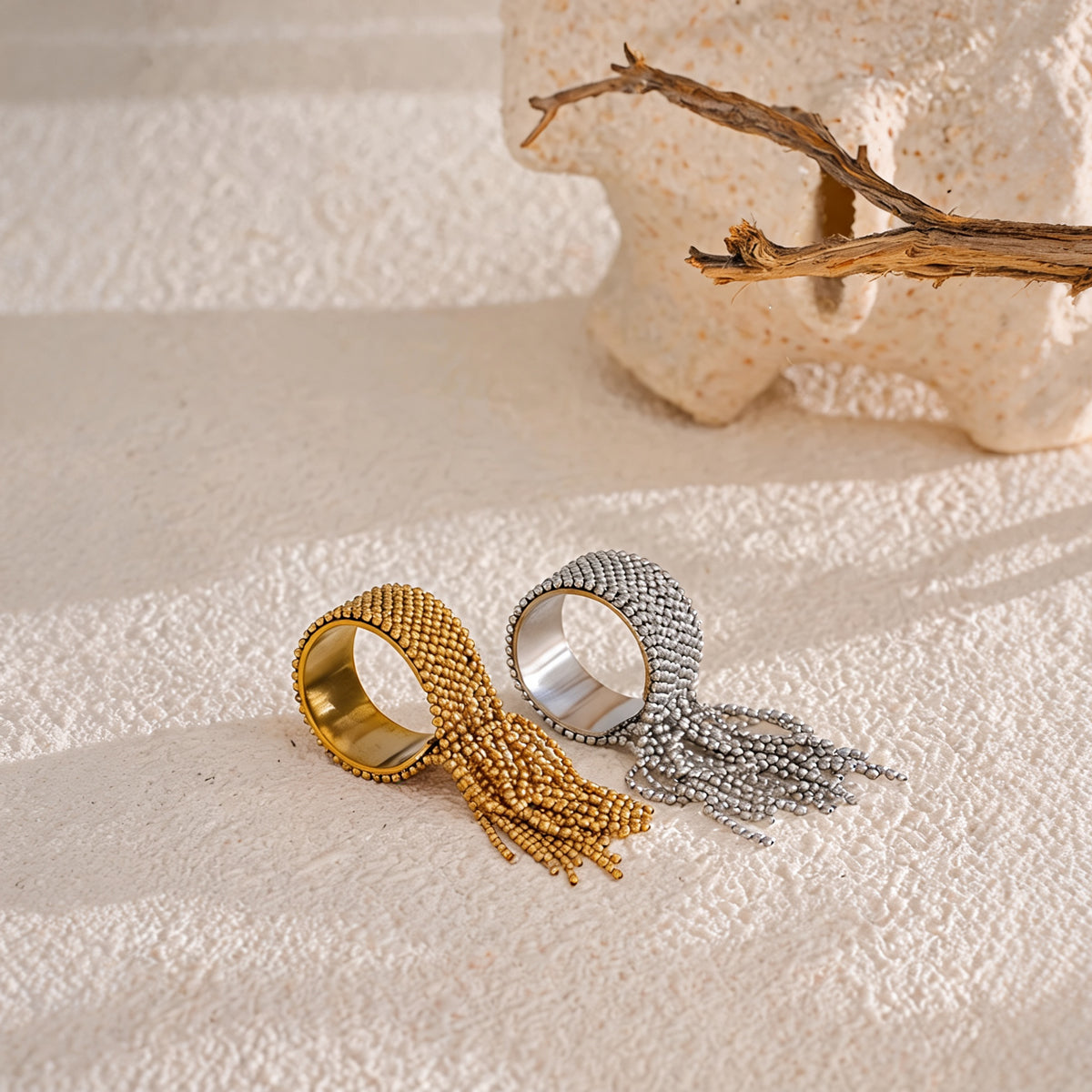 Tessa chain tassel rings styled in gold and silver