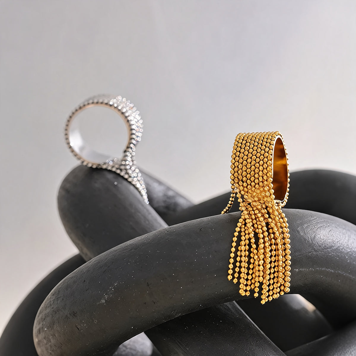 Tessa chain tassel rings styled in gold and silver