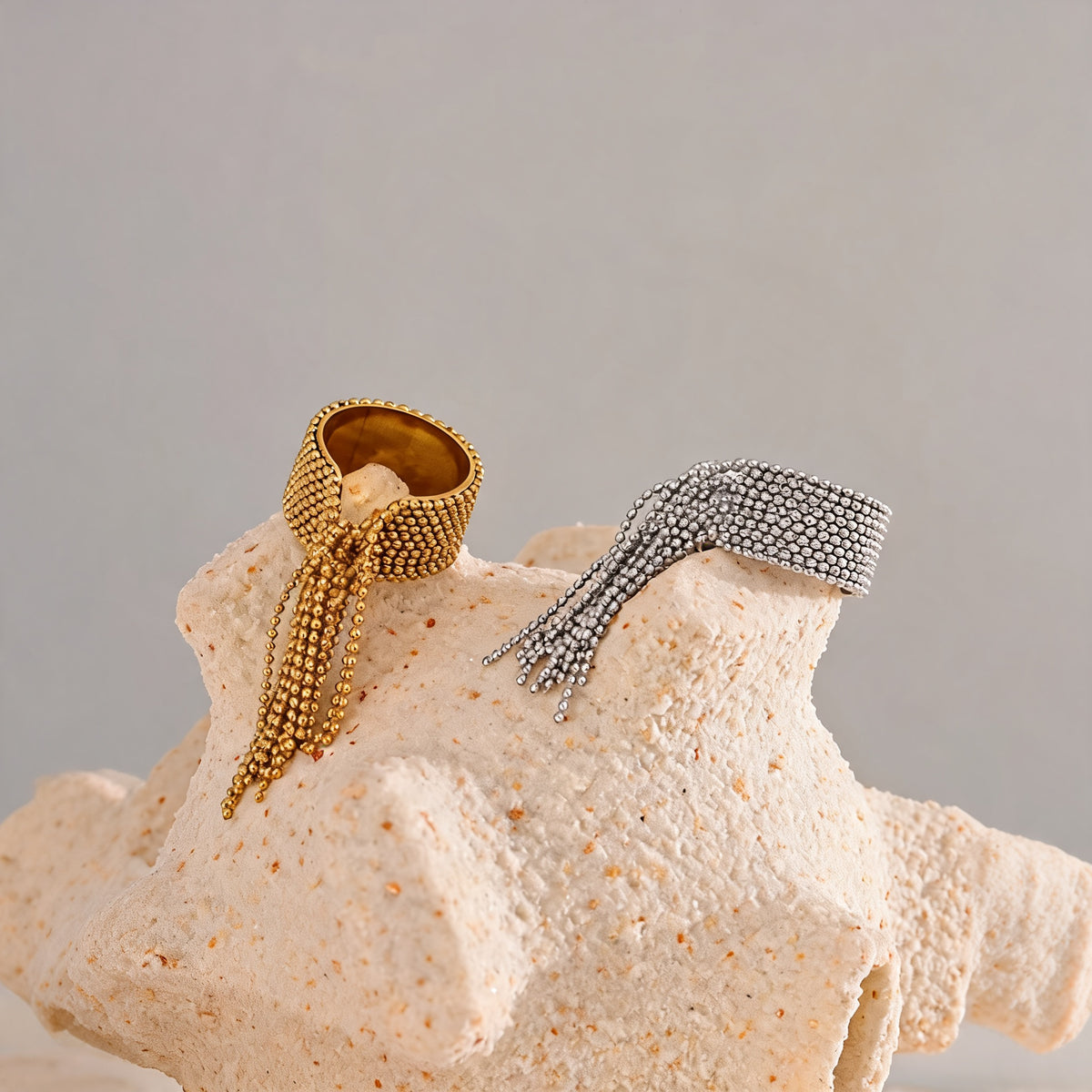 Tessa chain tassel rings styled in gold and silver