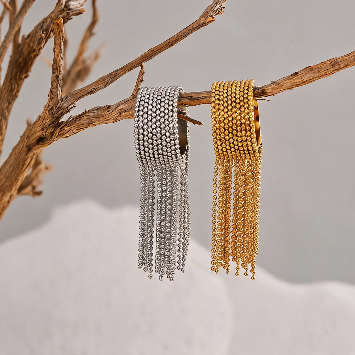 Tessa chain tassel rings styled in gold and silver