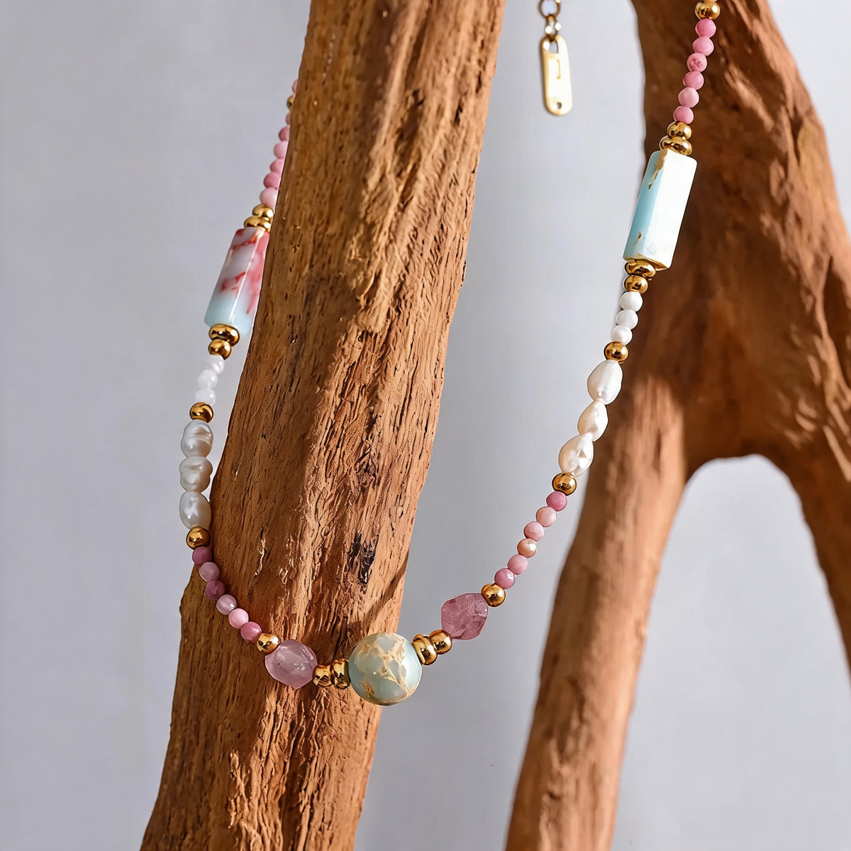 Willow Stone Pearl Necklace draped on driftwood